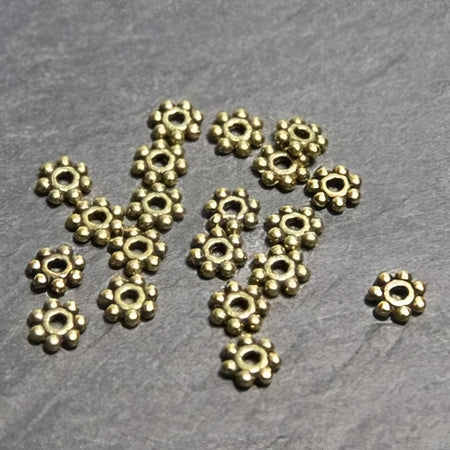 Perle Gänseblümchen mini goldf. 4mm 20 Stk.