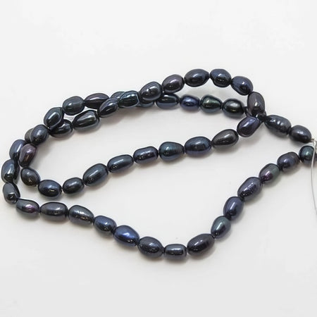Süsswasserperle Reis dunkel blau ca 6x4.5mm 1 Strang
