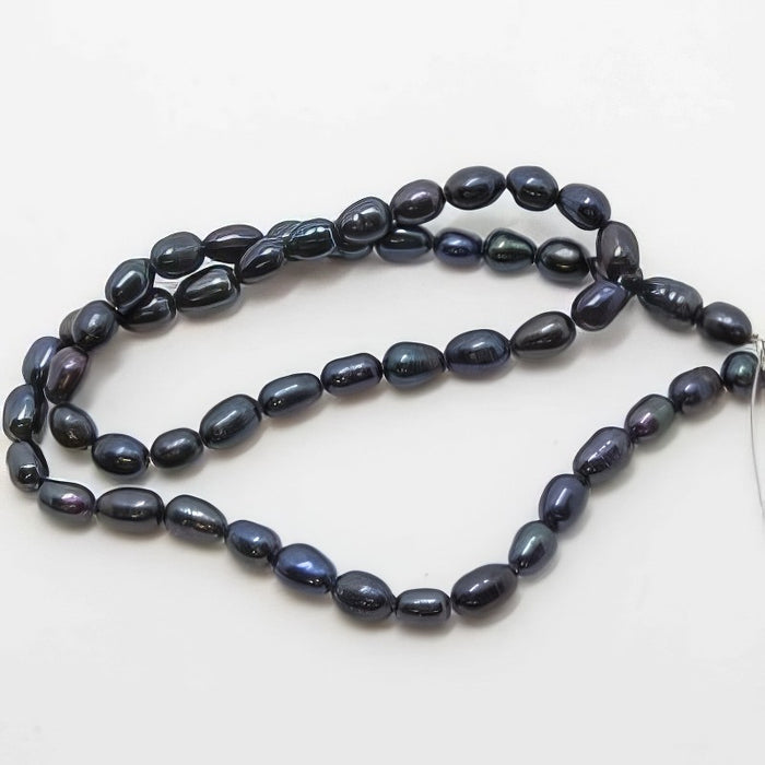 Süsswasserperle Reis dunkel blau ca 6x4.5mm 1 Strang