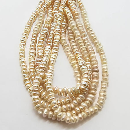 Süsswasserperle Mini creme/rose ca. 3mm 1 Strang