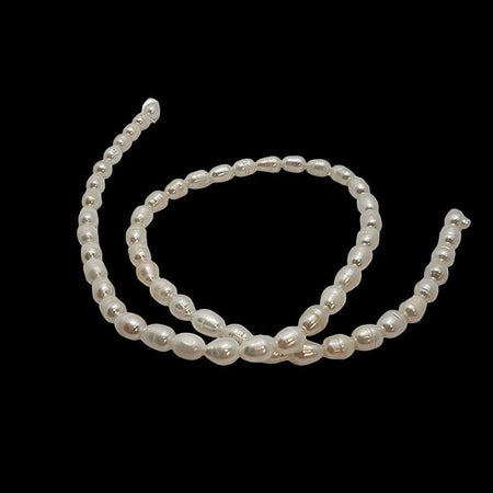 Süsswasserperle Reis ca. 5x7.5mm weiss Fl. 0.4-0.6mm  1 Stg