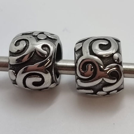 Metallperle Edelstahl Schnörkel 9x7.5mm 1Stk