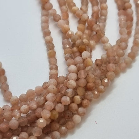 Sunstone 3mm facettiert Faedelloch 0.5mm 1 Strang