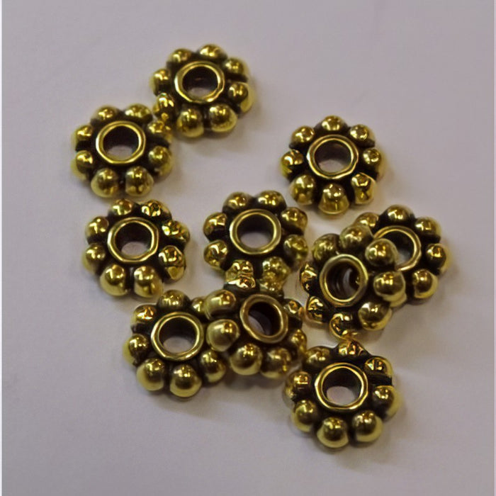 Perle Gänseblümchen 7.5mm goldf. 10 Stk.