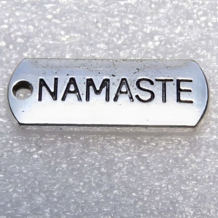 Rectangle pendant with various words 21x8mm 1 pc.