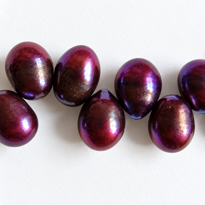 Perle d'eau douce violette grande 7x6mm 1 brin